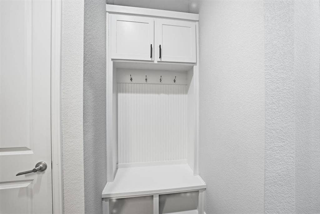 911 Midland Drive, Allen, TX 75013 Built-in white cabinetry featuring shaker-style doors and dark hardware