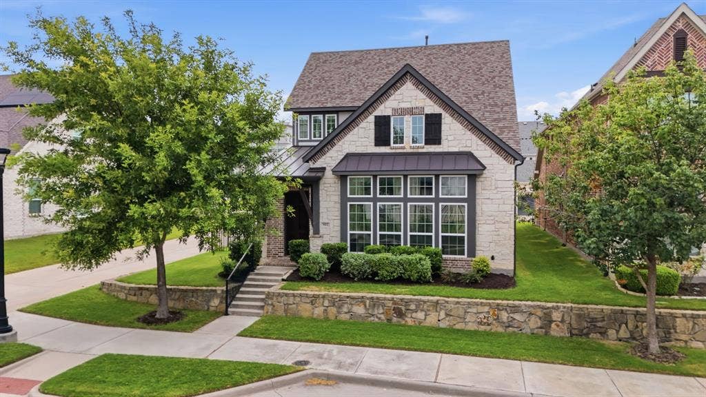 911 Midland Drive, Allen, TX 75013 Stone and siding exterior with a dark shingle roof