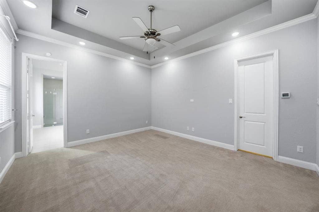 911 Midland Drive, Allen, TX 75013 Tray ceiling with recessed lighting, ceiling fan, carpeted flooring, and crown molding