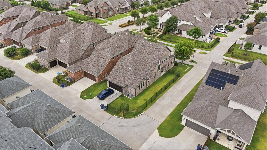 911 Midland Drive, Allen, TX 75013 Residential neighborhood with a mix of brick and siding exteriors, shingle roofs, and concrete driveways
