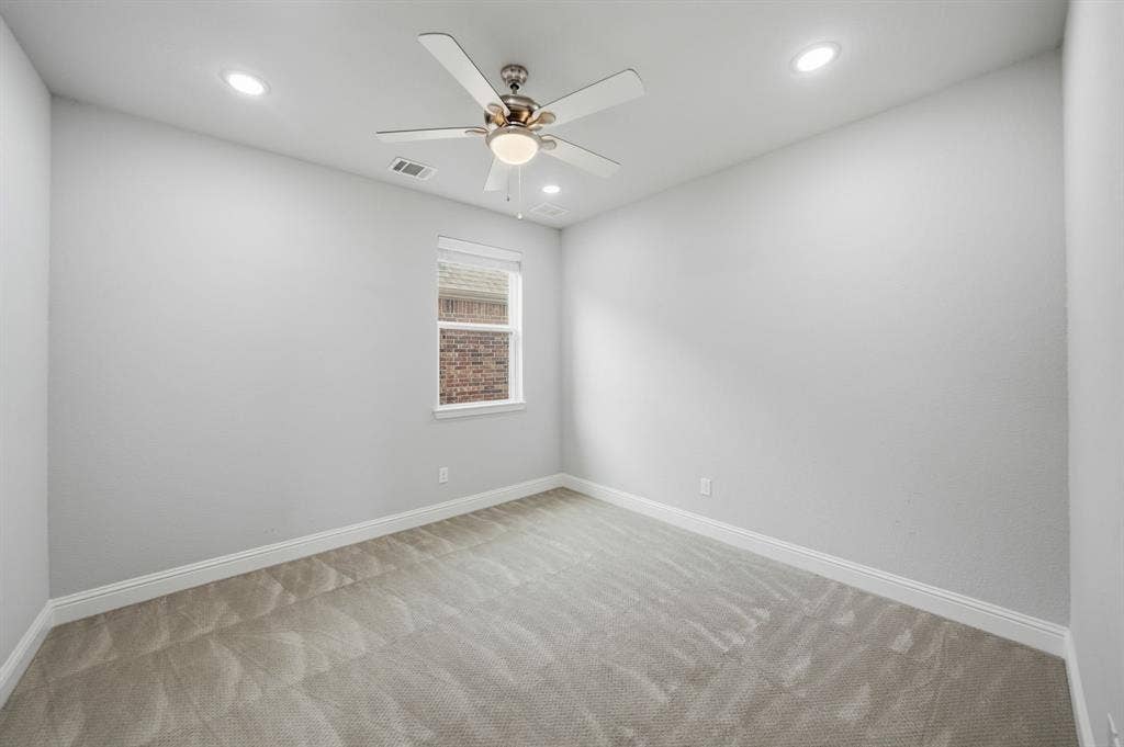 911 Midland Drive, Allen, TX 75013 Recessed lighting, ceiling fan, white trim, single window, and light gray carpet
