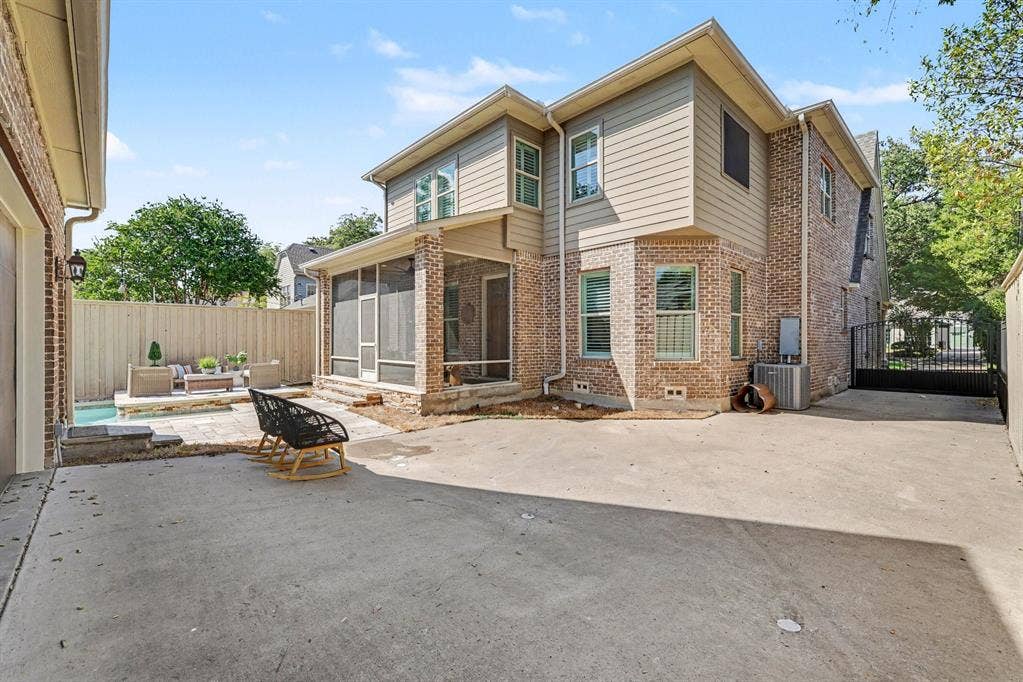 5542 Monticello Avenue, Dallas, TX 75206 Two-story brick and siding exterior with a screened porch and private entry gate