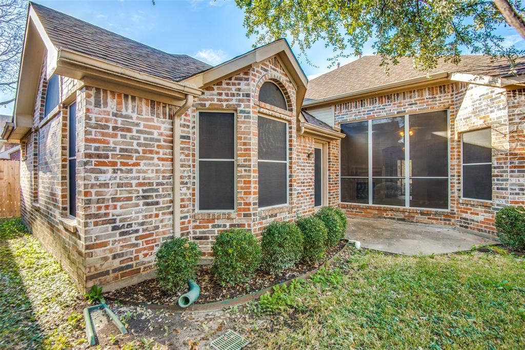 1913 Piney Creek Boulevard, Denton, TX 76205 Multi-tone brick exterior with a pitched roof