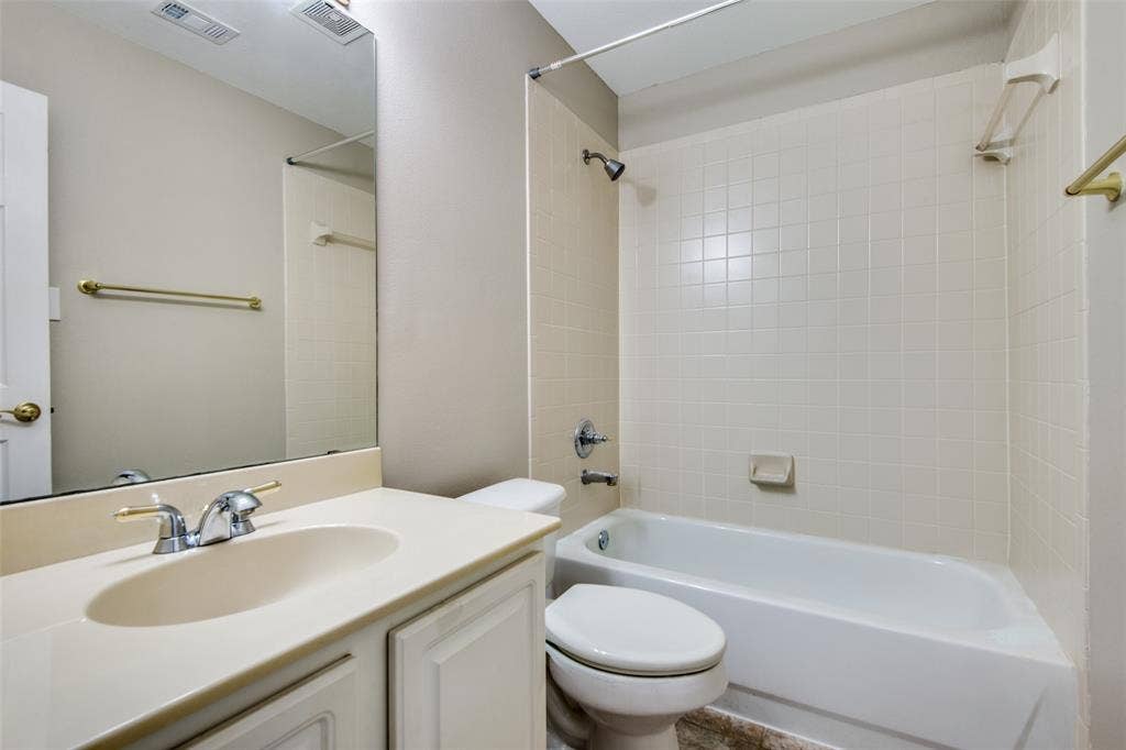 1913 Piney Creek Boulevard, Denton, TX 76205 Integrated vanity with an oval sink and chrome faucet