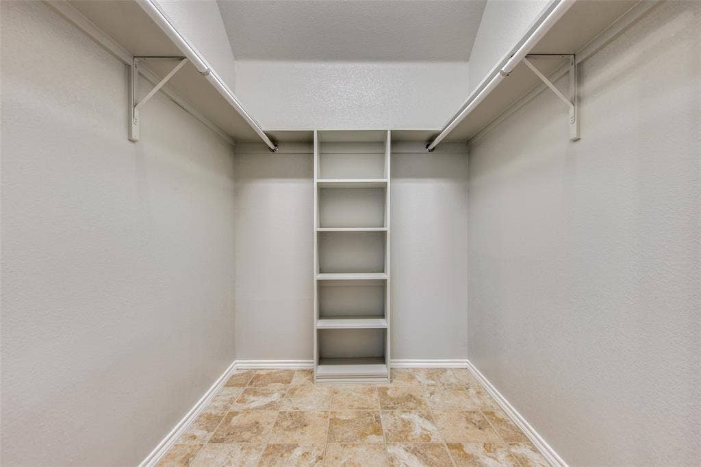 1913 Piney Creek Boulevard, Denton, TX 76205 Built-in shelving unit with multiple shelves