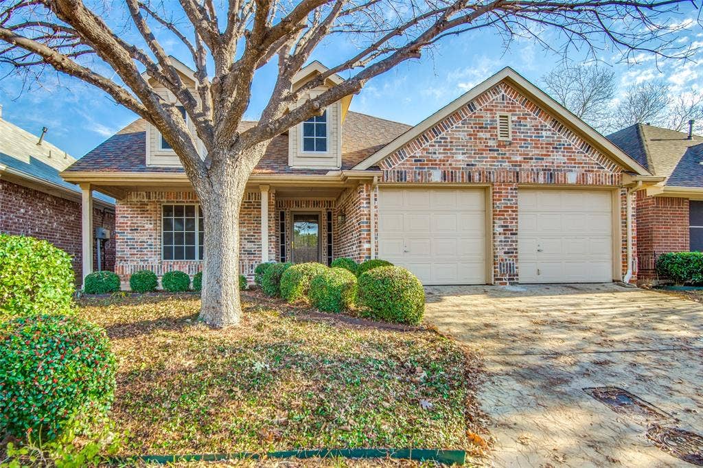 1913 Piney Creek Boulevard, Denton, TX 76205 Brick facade with a covered porch entrance
