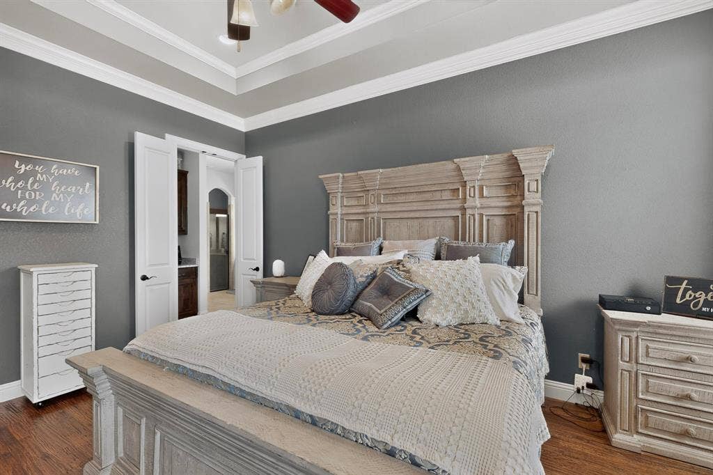 5020 Lindy Court, Midlothian, TX 76065 Tray ceiling with crown molding, wood-finish flooring, and white interior doors