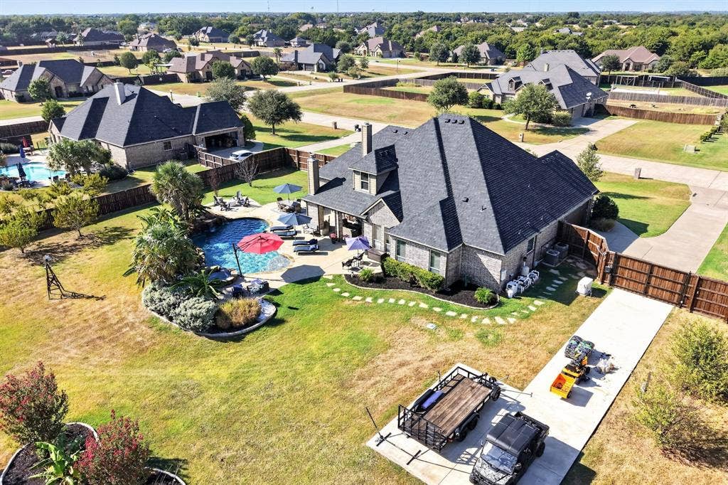 5020 Lindy Court, Midlothian, TX 76065 Brick exterior residence with a dark shingle roof
