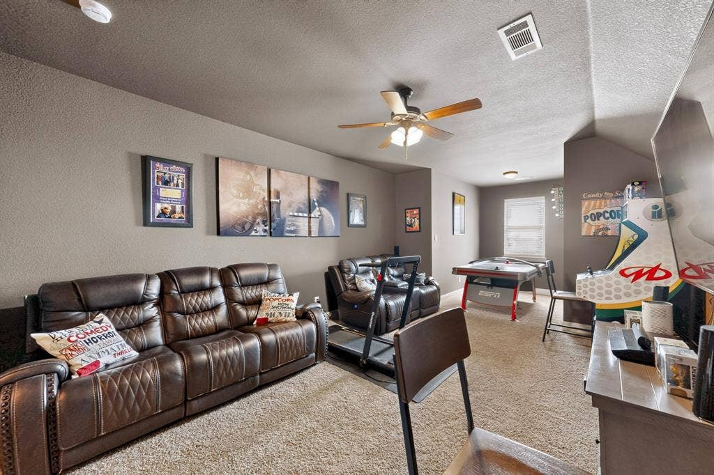 5020 Lindy Court, Midlothian, TX 76065 Carpeted room with sloped ceilings, ceiling fan, and recessed lighting