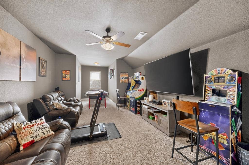 5020 Lindy Court, Midlothian, TX 76065 Carpeted room with sloped ceilings, recessed lighting, and a ceiling fan