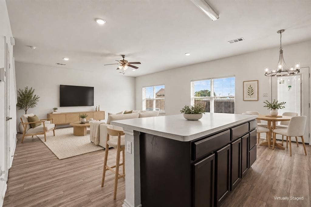 257 Michelle Drive, Grand Prairie, TX 75051 Virtually staged to illustrate furniture placement. The open living and dining areas connect directly to the kitchen for easy everyday living.