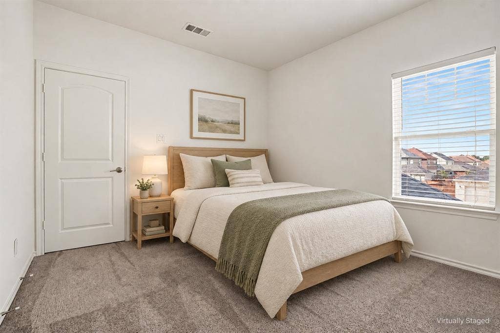 257 Michelle Drive, Grand Prairie, TX 75051 Virtually staged as a guest bedroom, showing one possible furniture layout with space for a bed and bedside table.