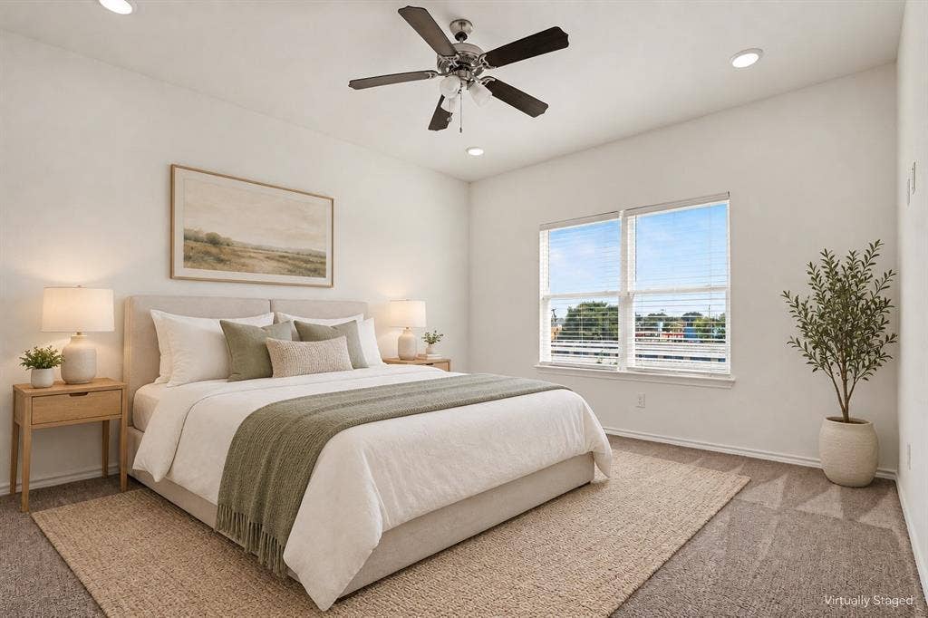 257 Michelle Drive, Grand Prairie, TX 75051 Virtually staged. A restful bedroom with a ceiling fan, recessed lighting and a wide window for natural light.