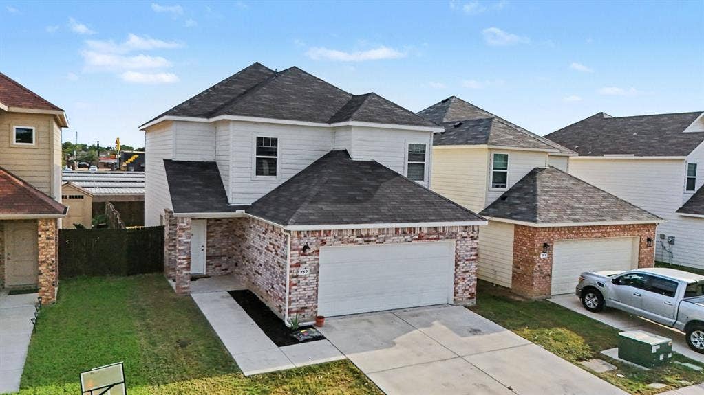 257 Michelle Drive, Grand Prairie, TX 75051 An elevated front view shows the home and its immediate surroundings.