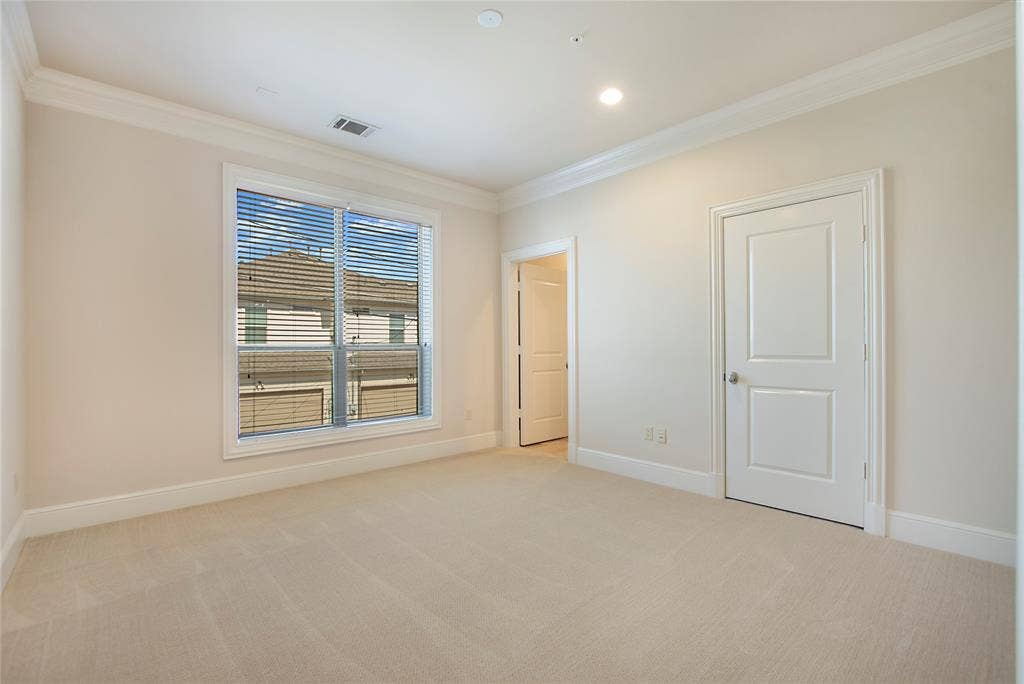 6525 Bandera Avenue, #2A, Dallas, TX 75225 Carpeted spare room featuring crown molding