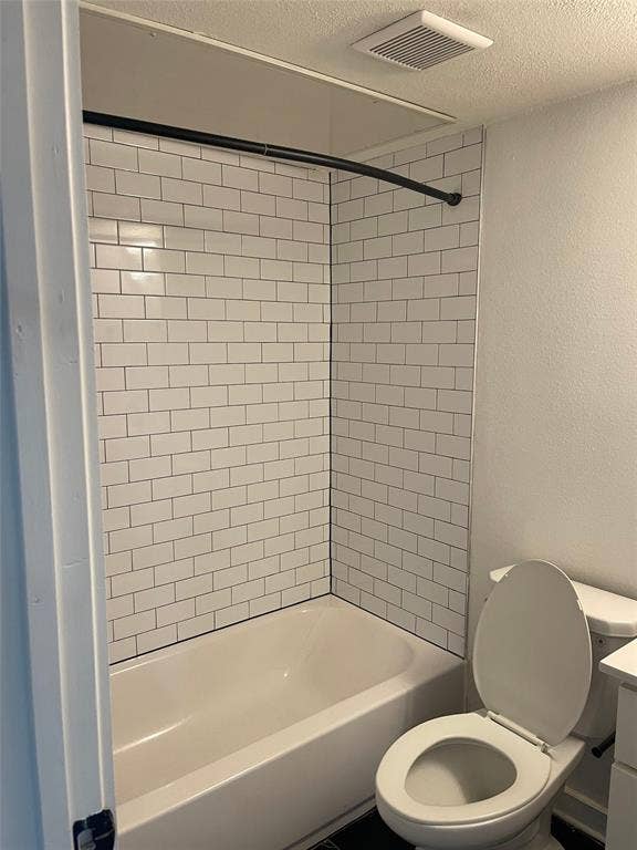 321 E 8th Street, #203, Dallas, TX 75203 Tub/shower combination featuring white subway tile surround and a curved shower rod