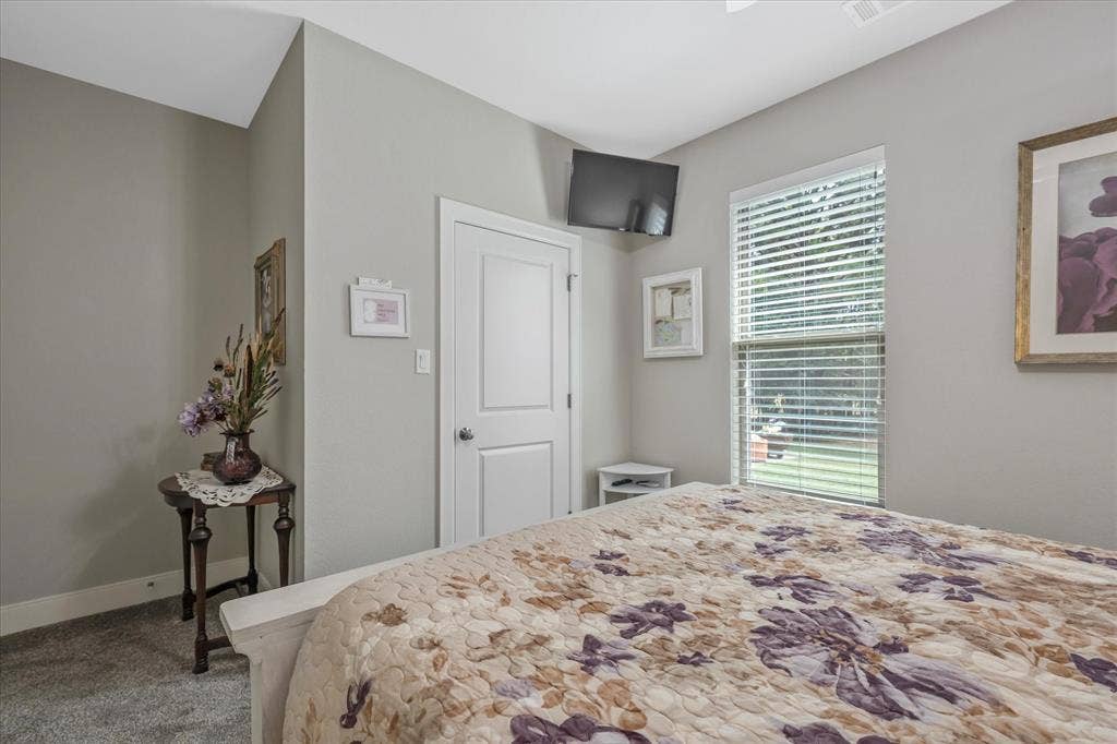 14486 Meadow Glen, Lindale, TX 75771 Neutral wall tones, white trim, and a window with horizontal blinds
