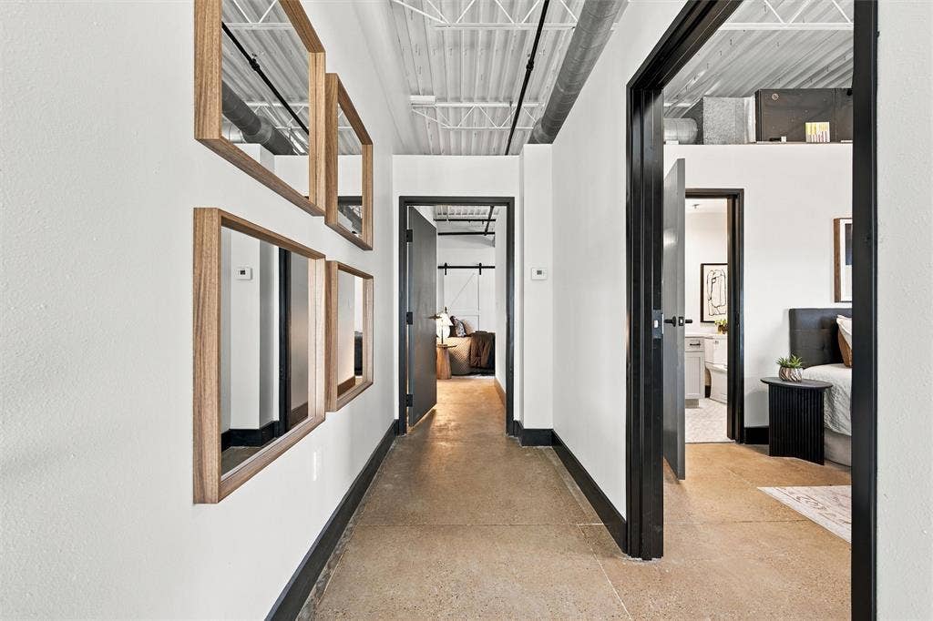 219 S 4th Street, #608, Waco, TX 76701 Concrete flooring with a white wall finish, exposed ceiling joists, and black trim