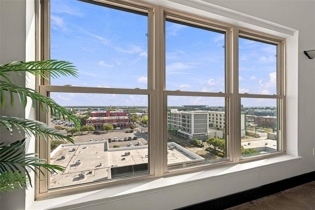 219 S 4th Street, #608, Waco, TX 76701 Expansive window wall with multiple panels, offering extensive urban and distant scenery