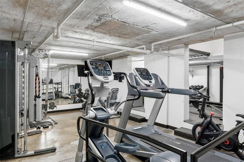 219 S 4th Street, #608, Waco, TX 76701 Fitness facility with exposed concrete ceiling and polished concrete flooring