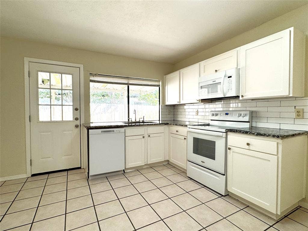 2525 Norway Drive, Garland, TX 75040 Kitchen opens to a large, covered patio