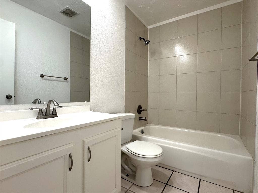 2525 Norway Drive, Garland, TX 75040 Shared full bathroom with natural stone counter tops