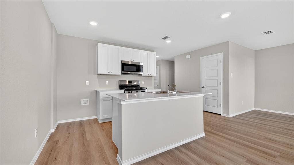 Kitchen-All Home and community information, including pricing, included features, terms, availability and amenities, are subject to change at any time without notice or obligation. All Drawings, pictures, photographs, video, square footages, floor plans, elevations, features, colors and sizes are approximate for illustration purposes only and will vary from the homes as built.