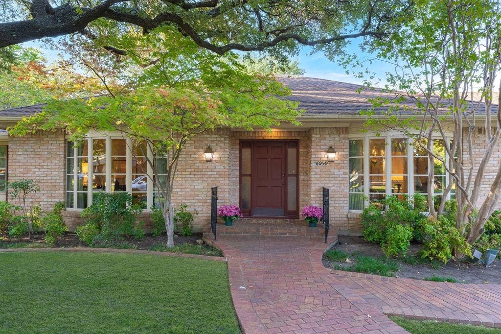 6950 Midcrest Drive, Dallas, TX 75254 Bay Windows showcase the front of the home.