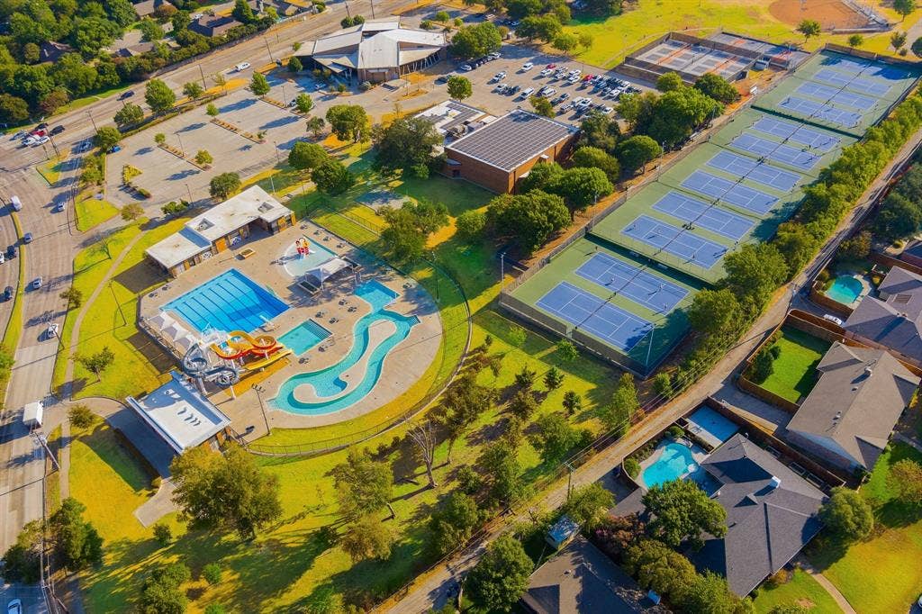 6950 Midcrest Drive, Dallas, TX 75254 Fretz Park with Community Pool, Tennis and Pickleball Center, Library, Fire Station, Recreation Center, Playground, Soccer and Baseball Fields.