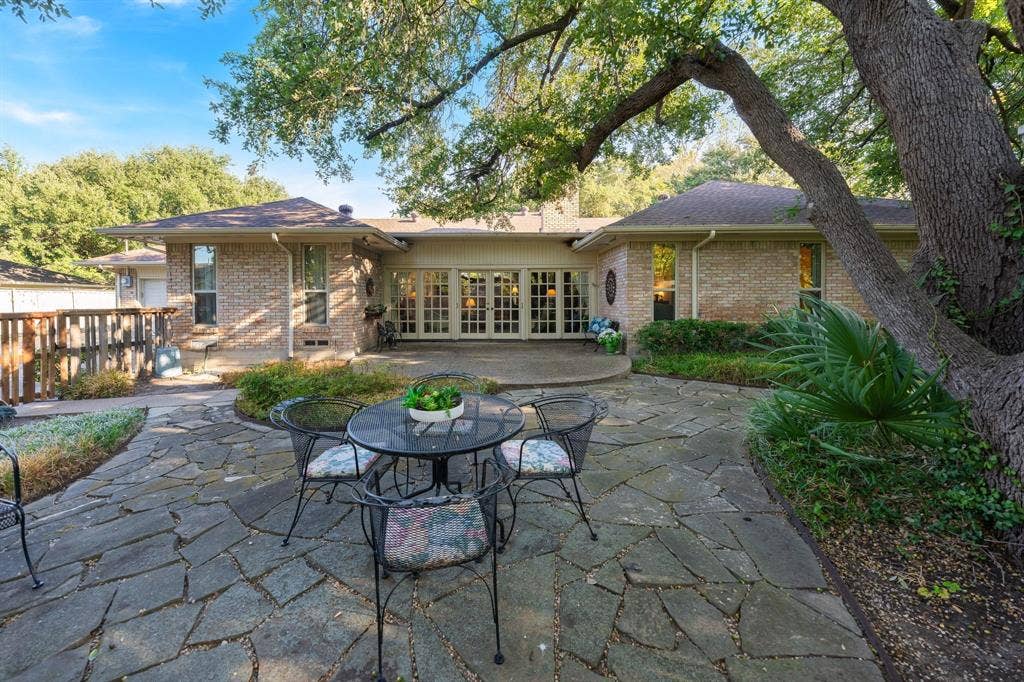 6950 Midcrest Drive, Dallas, TX 75254 Back of home with plenty of entertaining areas and patios.