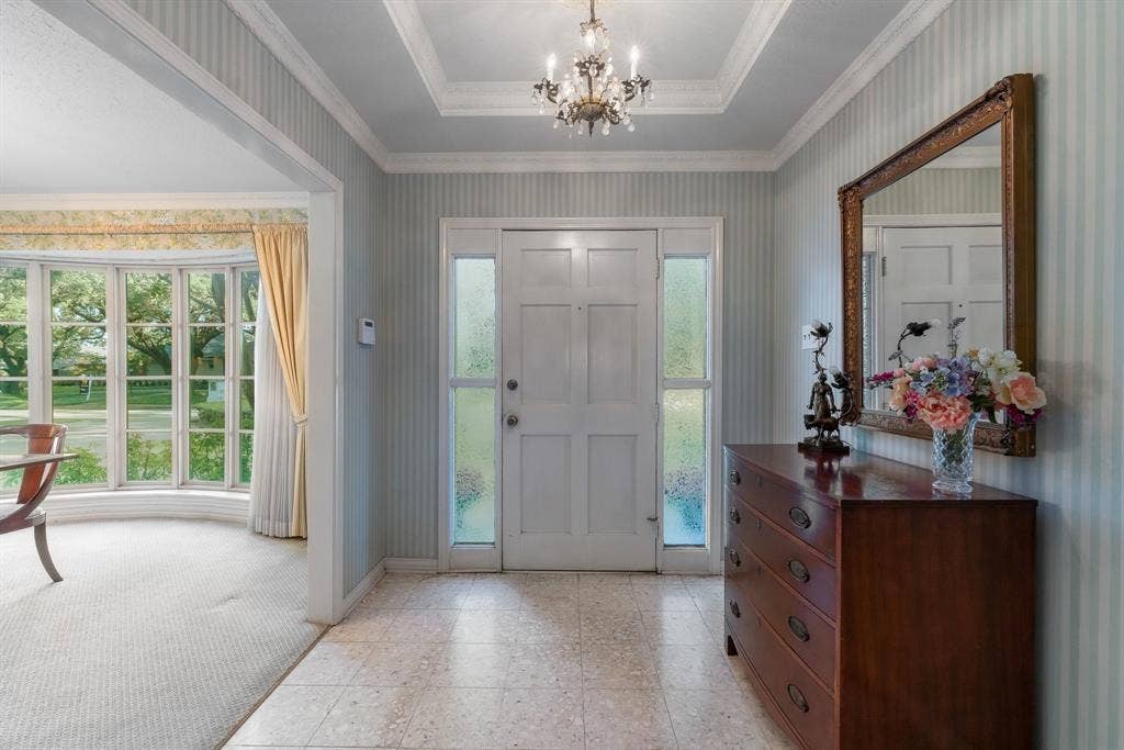 6950 Midcrest Drive, Dallas, TX 75254 Entry with two coat closets on each side. Open to the Dining Room.
