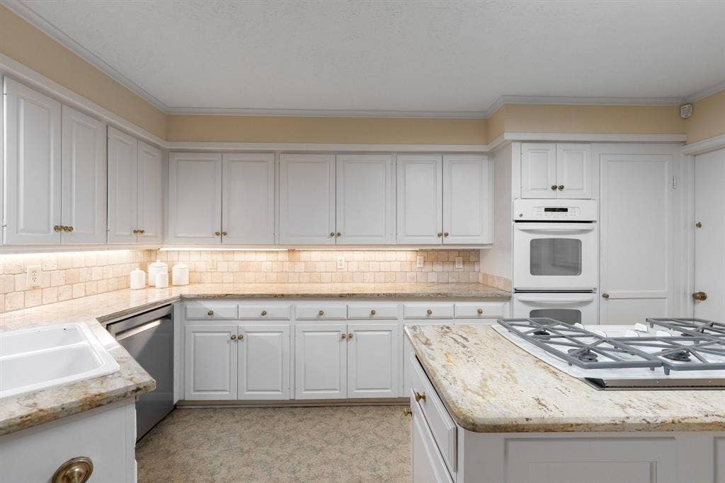 6950 Midcrest Drive, Dallas, TX 75254 Kitchen with an abundance of cabinets for plenty of storage.