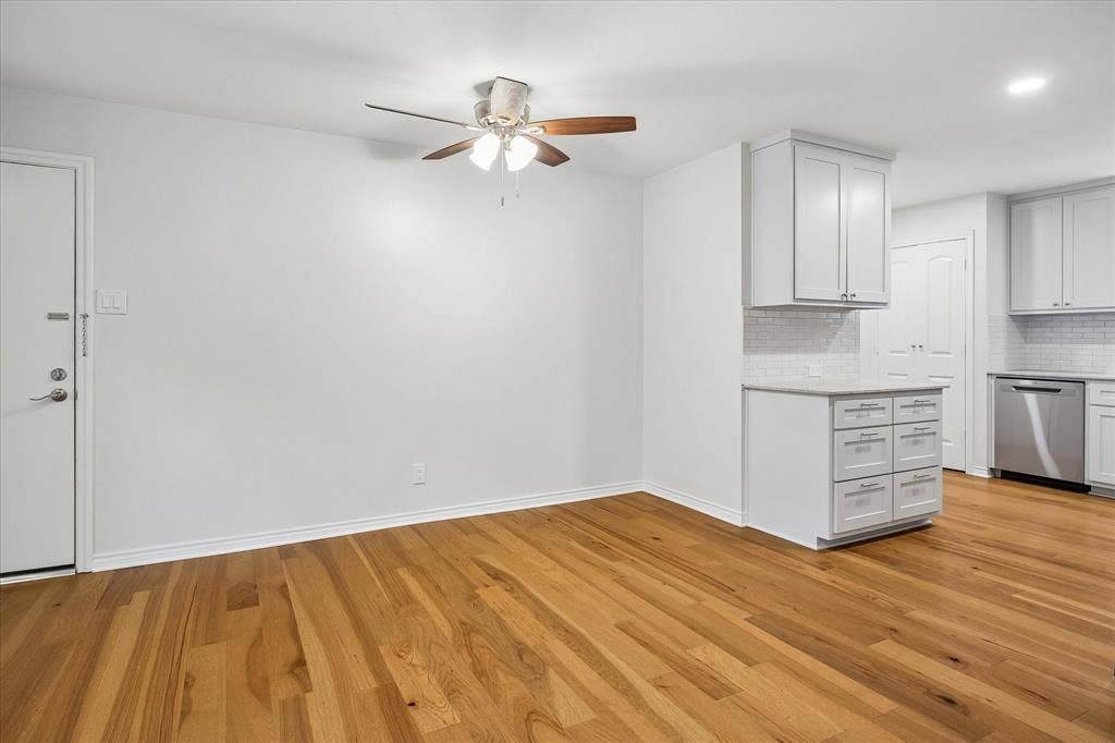 Living Area And Dining Area Lead To Kitchen