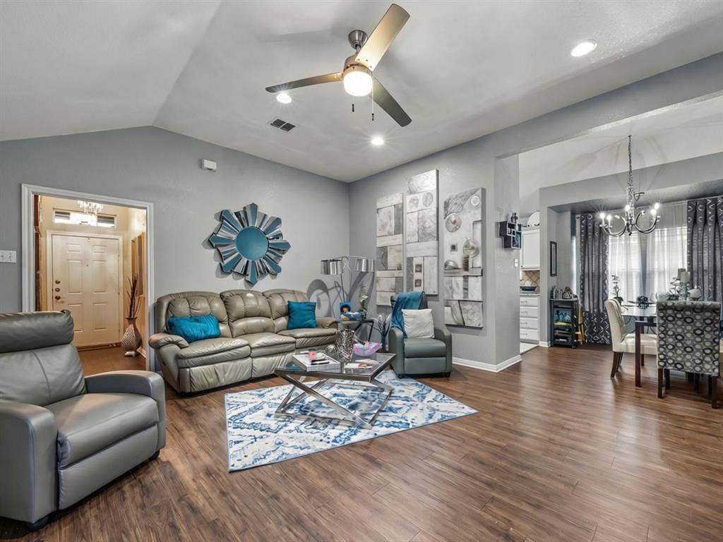 3012 Pinto Loop, Robinson, TX 76706 Spacious living area featuring wood-finish flooring, vaulted ceilings, and recessed lighting