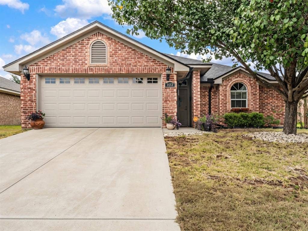 3012 Pinto Loop, Robinson, TX 76706 Brick exterior with a gabled roof and arched architectural details