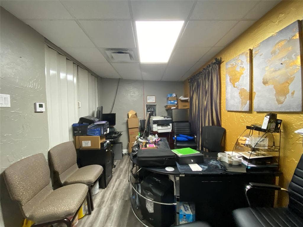 7041 Military Parkway, Dallas, TX 75227 Office featuring a drop ceiling and hardwood / wood-style flooring