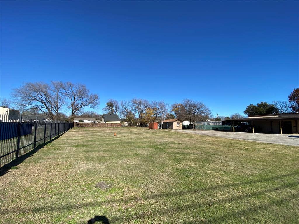 7041 Military Parkway, Dallas, TX 75227 View of yard featuring a carport