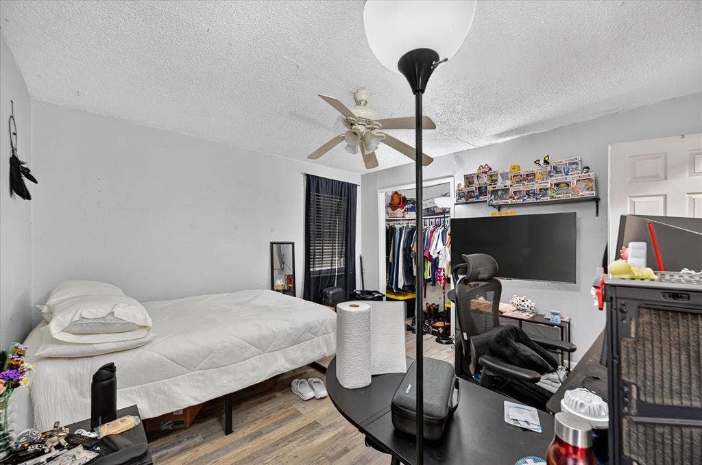 3320 Shorewood Drive, Mesquite, TX 75150 Wood-finish flooring with a ceiling fan light fixture