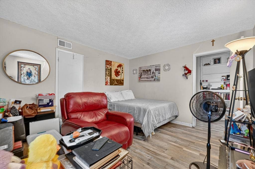 3320 Shorewood Drive, Mesquite, TX 75150 Wood-finish flooring with light-toned walls and a white textured ceiling