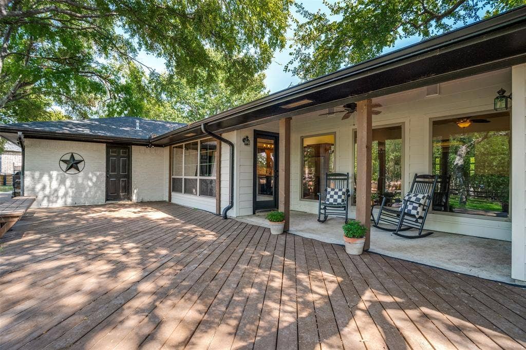 18 Brookhaven Drive, Lucas, TX 75002 The large deck spans the entire back side of the home and provides plenty of space for entertaining, grilling, etc.