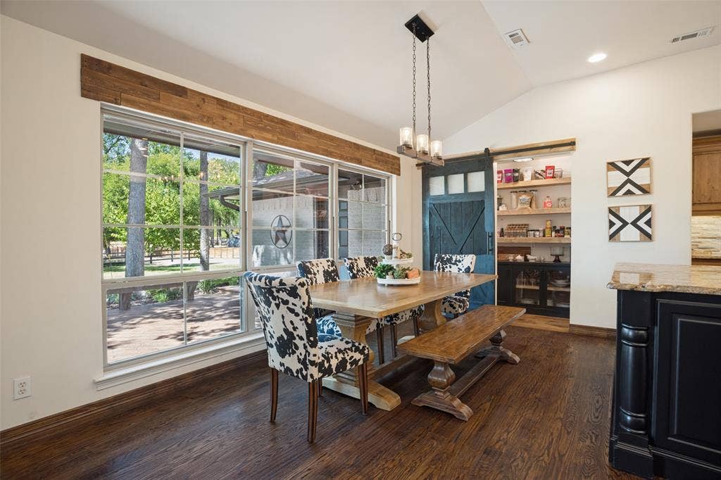 18 Brookhaven Drive, Lucas, TX 75002 Oversized breakfast area with custom walk-in pantry beyond. Beautiful views to back deck and yard.