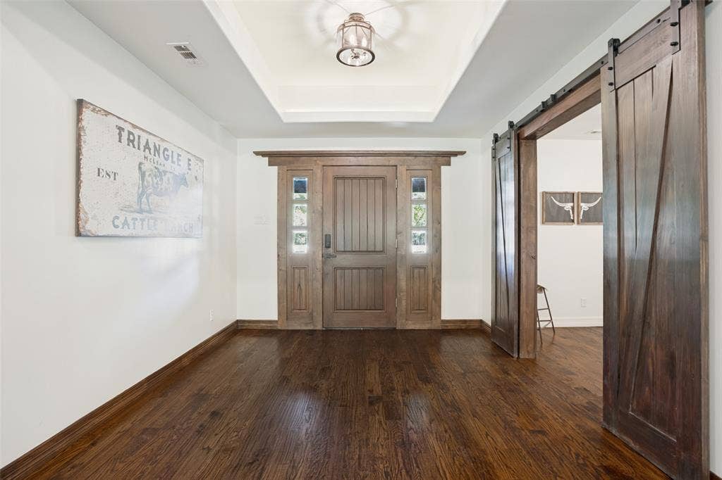 18 Brookhaven Drive, Lucas, TX 75002 Oversized entry with raised ceiling, custom lighting, beautiful custom entry door.
