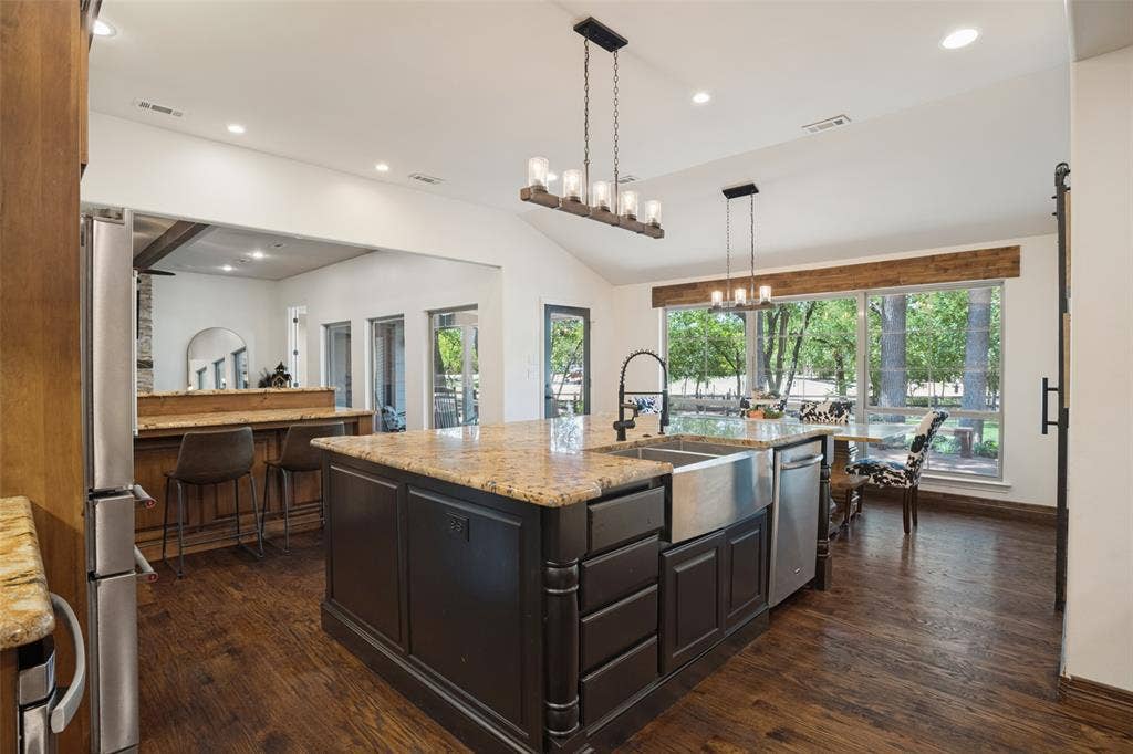 18 Brookhaven Drive, Lucas, TX 75002 The kitchen is an entertainer's dream. Plenty of space for a large family or guests. Granite countertops, extra deep stainless steel sink, custom lighting, breakfast bar area.