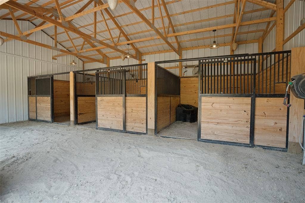 18 Brookhaven Drive, Lucas, TX 75002 Three 12 x 12 stalls with fans, sand flooring, extra covered space in front of stalls can be used as a run-in shelter in rainy weather.