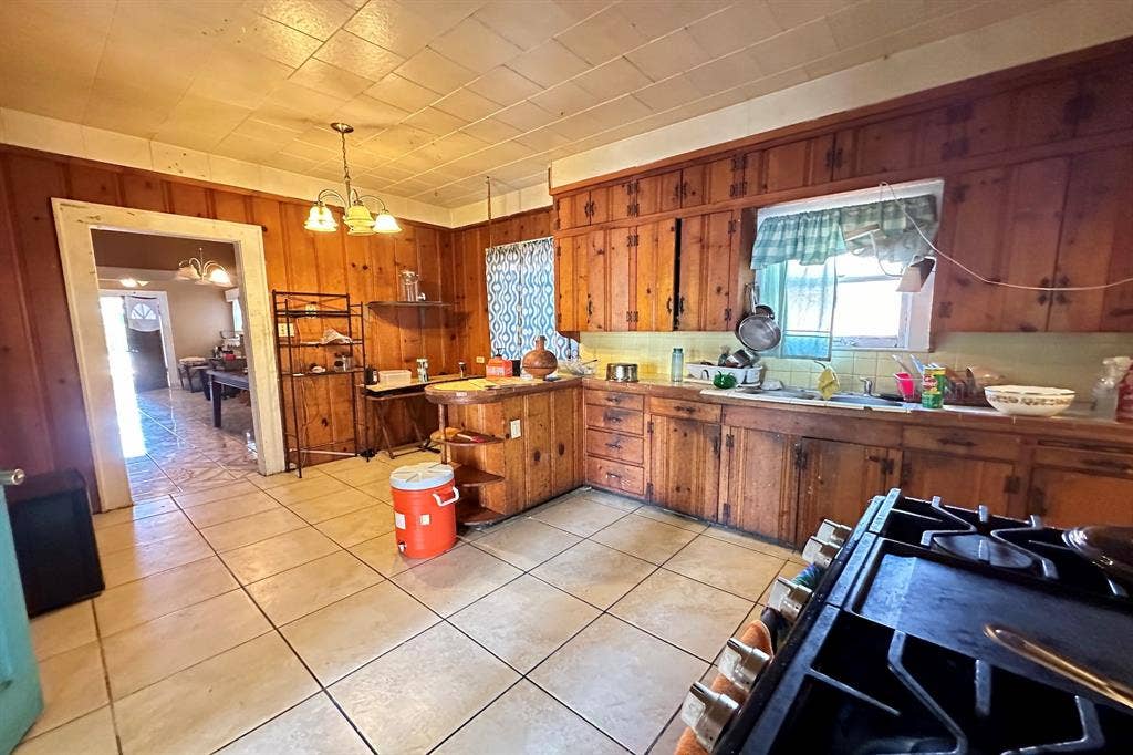 Kitchen from a from a different angle to showcase potential