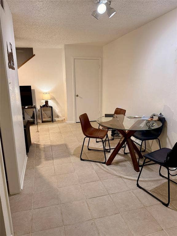 1915 S 10th Street, Waco, TX 76706 Tile flooring throughout, track lighting, and a white interior door