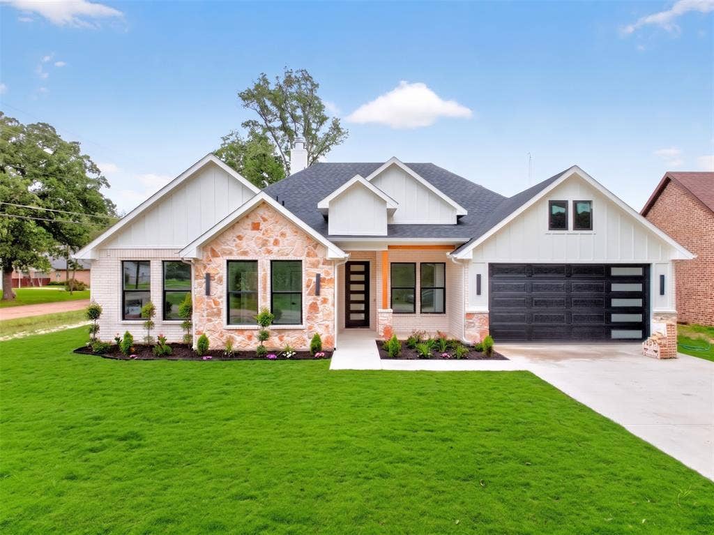 120 Springwood Road, Enchanted Oaks, TX 75156 Modern farmhouse exterior featuring white brick and natural stone accents