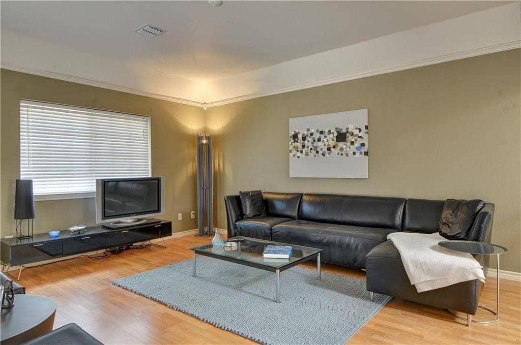 8626 Forest Glen Drive, Irving, TX 75063 Wood-finish flooring with crown molding and recessed lighting