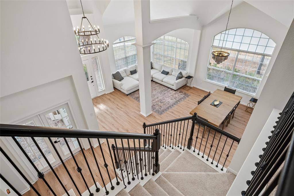 3801 Kite Meadow Drive, Plano, TX 75074 Two-story vaulted ceilings, wood-finish flooring, and large arched windows