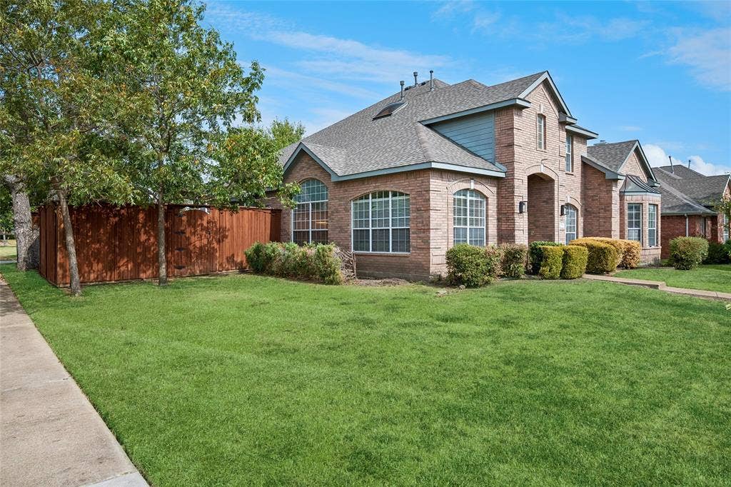 3801 Kite Meadow Drive, Plano, TX 75074 ** ENHANCED GRASS PHOTO**Brick exterior with an arched entryway
